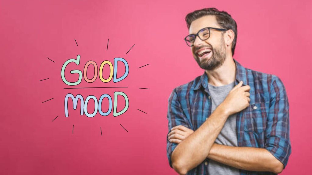 Man smiling with text saying 'Good Mood' in the background