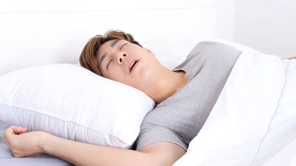 Woman troubled by snoring, linking poor sleep to mental health.