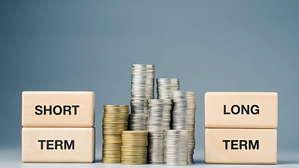 Stacks of coins representing short-term vs long-term costs.