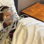 Patient undergoing a Level 1 sleep study with monitoring sensors and a PAP mask